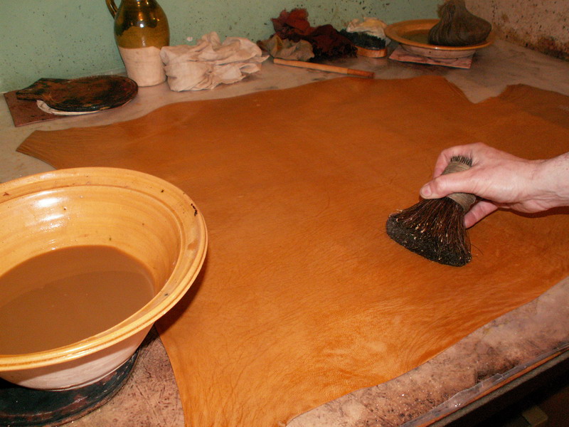 Dye being painted onto a goatskin