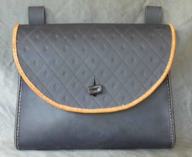 16th - 17th century belt wallet with a  tooled round front and side gussets