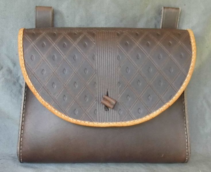 16th - 17th century belt wallet with a  tooled round front and side gussets